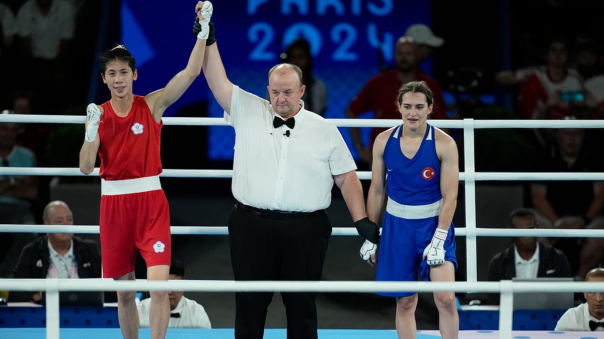 (AP Photo/John Locher) : Taiwan's Lin Yu-ting, left, celebrates after defeating Turkey's Esra Yildiz in their women's 57 kg semifinal boxing match at the 2024 Summer Olympics, Wednesday, Aug. 7, 2024, in Paris, France. 